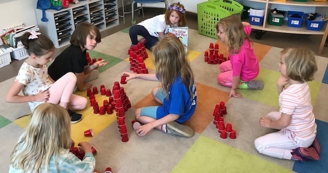 students building qith red blocks